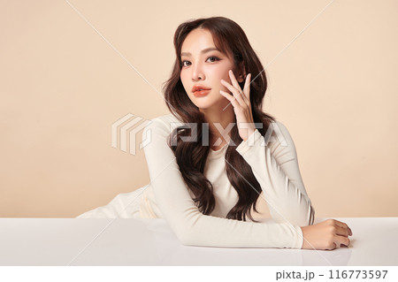 Beautiful young asian woman with clean fresh skin on beige background, Face care, Facial treatment, Cosmetology, beauty and spa, Asian women portrait. 116773597