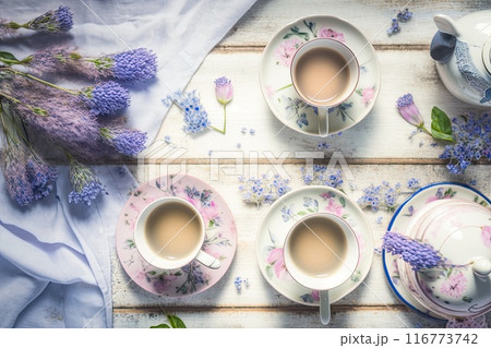 Cups of tea and beautiful flowers. Refined vintage dishes. Generative Ai 116773742