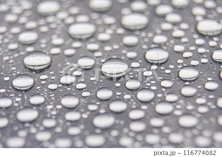 Water droplets on clear glass with dark cover background. Suitable for design and wallpaper 116774082