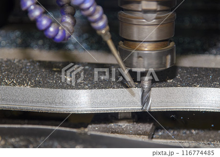 The CNC milling machine rough cutting the mold parts by flat end mill tools. The CNC milling machine rough cutting the mold parts by flat end mill tools. 116774485