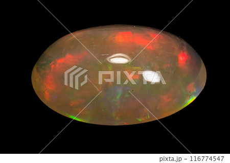 natural rainbow opal gem isolated on black background natural rainbow opal gem isolated on black background 116774547