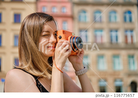 Young Woman Taking Photos in European City 116775657