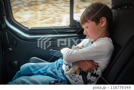Young adorable happy toddler boy enjoying a ride with the bus. View through the window. 116776349