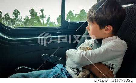 Young adorable happy toddler boy enjoying a ride with the bus. View through the window. 116776350