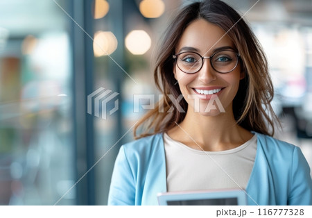 Woman Holding Tablet in Office 116777328