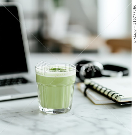 Matcha Latte and Laptop on Marble Table 116777366