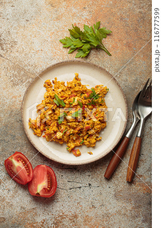 Plate of akuri indian style scrambled eggs with spices and herbs top view Plate of akuri indian style scrambled eggs with spices and herbs top view 116777599