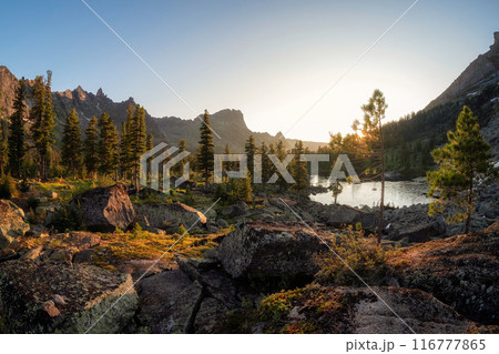 Stunning sunrise on the lake. Nature Park in the mountains of Siberia. Stunning sunrise on the lake. Nature Park in the mountains of Siberia. 116777865