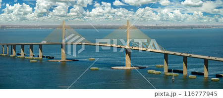 Sunshine Skyway Bridge over Tampa Bay in Florida with moving traffic. Concept of transportation infrastructure 116777945