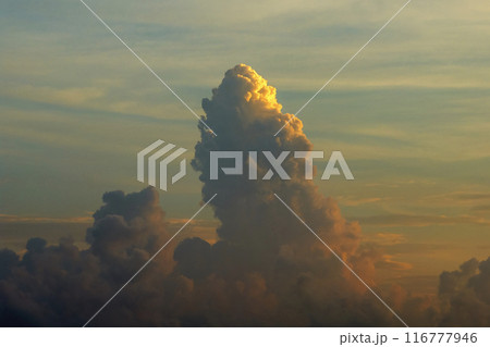 Sunset sky with bright colorful orange and yellow clouds. Panoramic skyscape 116777946