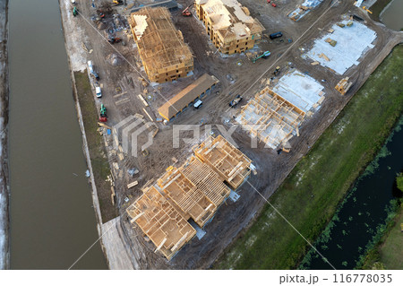 New apartment buildings under construction in North Port, Florida. Development of residential housing in US suburbs. Real estate market in the USA 116778035