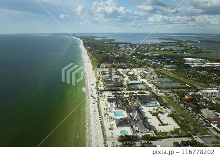 View from above of large residential homes in island small town Boca Grande on Gasparilla Island in southwest Florida. American waterfront houses in rural US suburbs 116778202