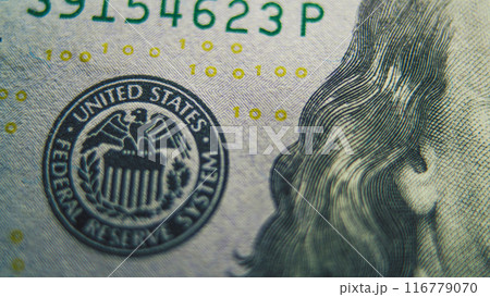 Process of examining authenticity of of hundred dollar bill 116779070