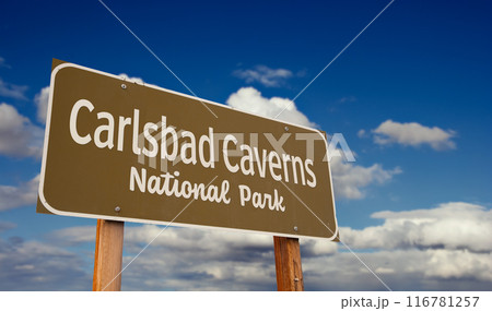 Carlsbad Caverns National Park (New Mexico) Road Sign Against Blue Sky and Clouds. Carlsbad Caverns National Park (New Mexico) Road Sign Against Blue Sky and Clouds. 116781257