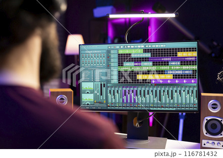 Sound engineer working with audio recordings on daw software interface, editing and adjusting volume levels for new music. Producer adding sound effects on soundtracks, signal processing. Sound engineer working with audio recordings on daw software interface, editing and adjusting volume levels for new music. Producer adding sound effects on soundtracks, signal processing. 116781432