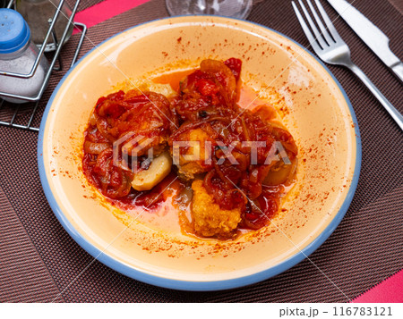 On plate, baked juicy vegetables, complemented by tender cod fillet with xanfaina sauce On plate, baked juicy vegetables, complemented by tender cod fillet with xanfaina sauce 116783121