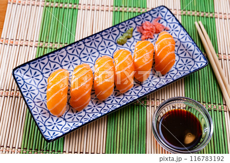Sushi sake nigiri with salmon served on platter Sushi sake nigiri with salmon served on platter 116783192