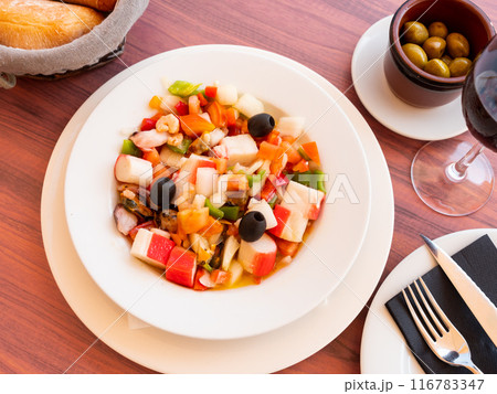 Seafood and vegetable salad served on platter 116783347