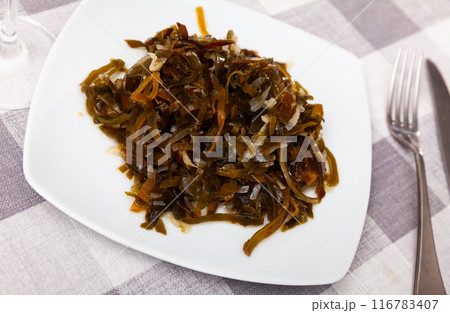 Portion of just cooked salad made of sea cabbage and onion Portion of just cooked salad made of sea cabbage and onion 116783407