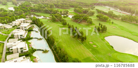 Aerial view of golf course and luxury villas in Belek, Turkey. Scenic panoramic view of golf fairway Aerial view of golf course and luxury villas in Belek, Turkey. Scenic panoramic view of golf fairway 116785688