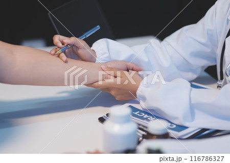 Asian female medical doctor use stethoscope to listen examine check senior elderly patient heart 116786327