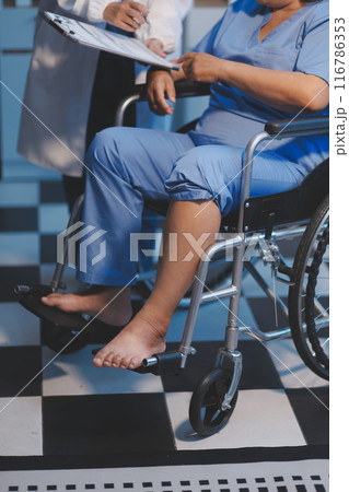 Asian female medical doctor use stethoscope to listen examine check senior elderly patient heart 116786353