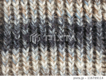 Knitted wool texture, close up. Knitting crochet. Knitting hobby. Striped pattern of wool yarn. Warm winter clothes. Needlework concept. Homemade creativity. Vintage lifestyle. 116789114