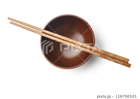 Pair of wooden chopsticks and wooden bowl isolated on white background. 116790503