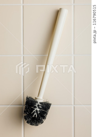 Toilet brush. White wc brush on tile floor. Top view. 116790515