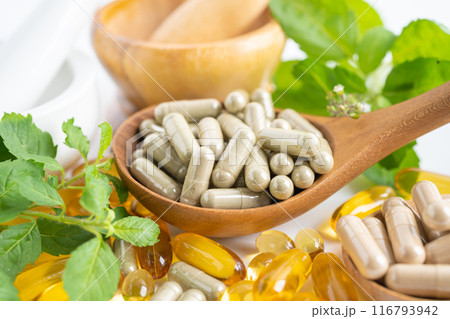 Alternative medicine herbal organic capsule with vitamin E omega 3 fish oil, mineral, drug with herbs leaf natural supplements for healthy good life. Alternative medicine herbal organic capsule with vitamin E omega 3 fish oil, mineral, drug with herbs leaf natural supplements for healthy good life. 116793942