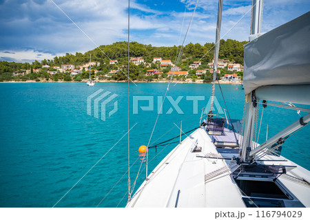 Yacht sailing near Croatia coast. Close-up view of the deck, mast and sails. Yachting concept Yacht sailing near Croatia coast. Close-up view of the deck, mast and sails. Yachting concept 116794029