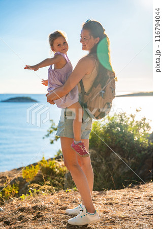 Mother and daughter in shore in the bay of Uvala Gradina near the town of Vela Luka on the island of Korcula in Croatia Mother and daughter in shore in the bay of Uvala Gradina near the town of Vela Luka on the island of Korcula in Croatia 116794044