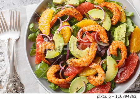 Citrus Shrimp and Avocado Salad closeup on the plate. Horizontal top view Citrus Shrimp and Avocado Salad closeup on the plate. Horizontal top view 116794862