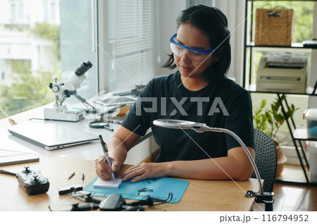 Woman Making List Of Necessary Details 116794952