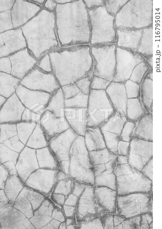 The image is a close up of a wall with cracks and holes in it 116795014