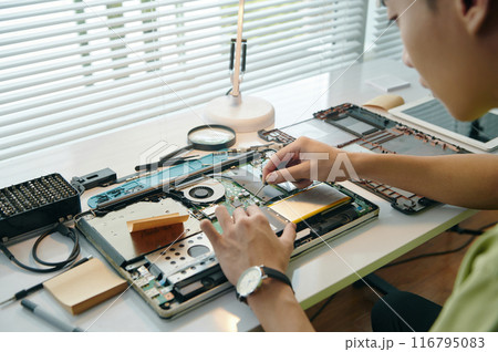 Repairman Repairing Laptop In Workshop Repairman Repairing Laptop In Workshop 116795083