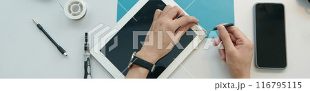 Repairman Repairing Broken Screen Of Digital Tablet Repairman Repairing Broken Screen Of Digital Tablet 116795115