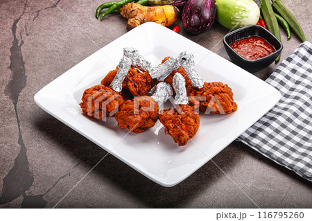 Indian cuisine glazed chicken lollipop Indian cuisine glazed chicken lollipop 116795260