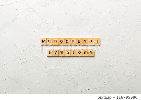 menopausal symptoms word written on wood block. menopausal symptoms text on cement table for your desing, concept 116795990