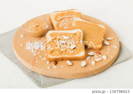 Peanut butter sandwiches or toasts on light table background.Breakfast. Vegetarian food. American cuisine top view vith copy space Peanut butter sandwiches or toasts on light table background.Breakfast. Vegetarian food. American cuisine top view vith copy space 116796023