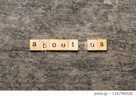 About us word written on wood block. About us text on cement table for your desing, concept About us word written on wood block. About us text on cement table for your desing, concept 116796026