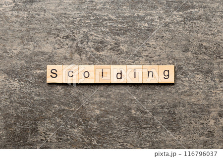scolding word written on wood block. scolding text on table, concept scolding word written on wood block. scolding text on table, concept 116796037