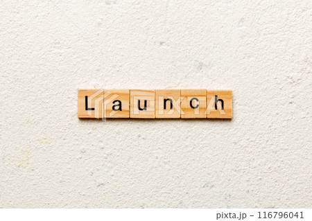 launch word written on wood block. launch text on table, concept launch word written on wood block. launch text on table, concept 116796041