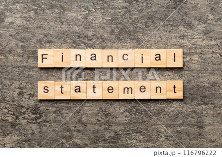 Financial statement word written on wood block. Financial statement text on cement table for your desing, concept 116796222
