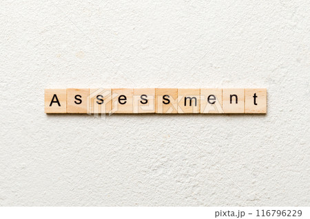 assessment word written on wood block. assessment text on table, concept assessment word written on wood block. assessment text on table, concept 116796229