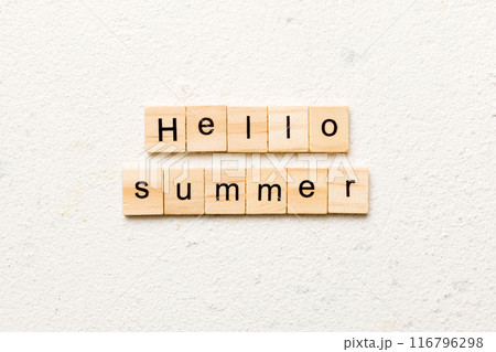 Hello Summer word written on wood block. Hello Summer text on cement table for your desing, concept 116796298