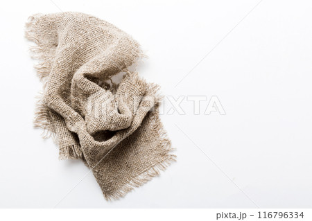 Old burlap fabric napkin, sackcloth on table background. top view with copy space 116796334