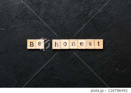 be honest word written on wood block. be honest text on table, concept 116796491