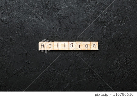 Religion word written on wood block. Religion text on cement table for your desing, concept Religion word written on wood block. Religion text on cement table for your desing, concept 116796510