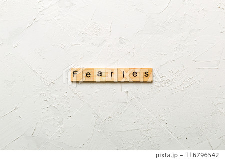Fearless word written on wood block. Fearless text on cement table for your desing, concept Fearless word written on wood block. Fearless text on cement table for your desing, concept 116796542